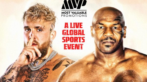 Fight card banner featuring Jake Paul on the left, making a shush gesture with his finger to his lips, and Mike Tyson on the right, displaying his signature intense stare, set against the backdrop of the event details for their upcoming boxing match.