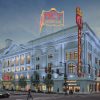 The Metropolitan Opera House in Philadelphia, also known as The Met, captured in a photograph that showcases its grand architecture and historical significance, with details highlighting its role as a premier venue for performances and events in the city.