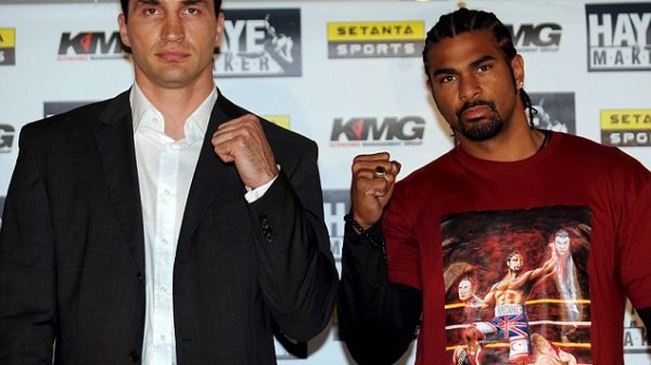 Wladimir Klitschko and David Haye posing before their fight, with Haye wearing his controversial T-shirt that shows him decapitating the Klitschko brothers