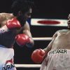 Pernell 'Sweet Pea' Whitaker skillfully dodging a punch from Roberto Duran, showcasing his legendary defensive prowess in the boxing ring.