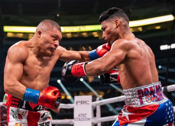 Isaac Cruz lands a left hook on Yuriorkis Gamboa